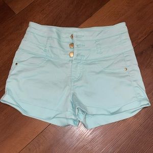 Turquoise high wasted shorts by refuge. Used but in good condition. Size 0